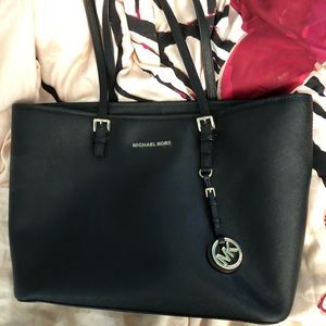 Gently used Michael Kors medium  Jet set travel
